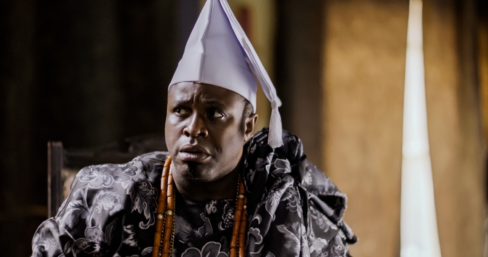 Femi Adebayo as Oba Kosoko in royal regalia